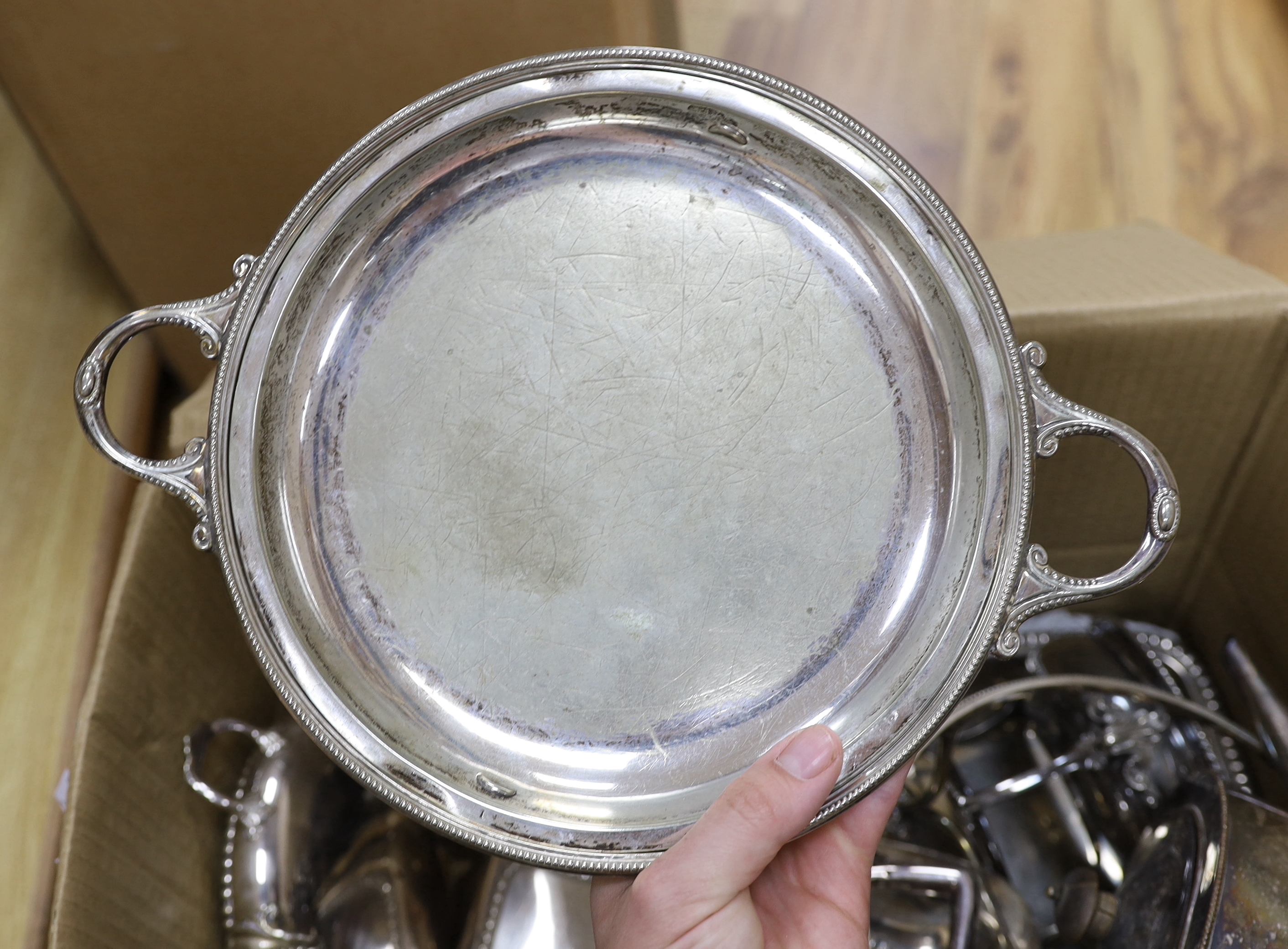A collection of plated wares, including entree dishes, an oval engraved tray, a circular vegetable tureen and cover, two teapots, etc.